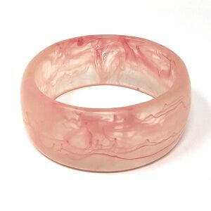 Acrylic pink bangle bracelet with swirl designs